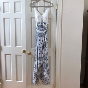 Gorgeous wrap dress with a draw string back.